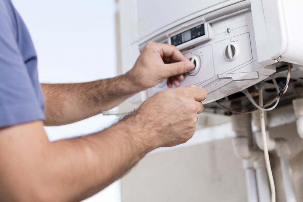 Male working on A/C Unit